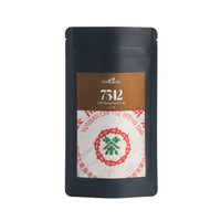1998 "7542" sheng puerh in its Global Tea Hut pouch