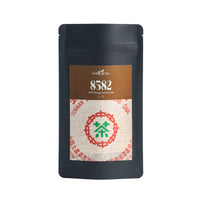 1999 "8582" sheng puerh in its Global Tea Hut pouch
