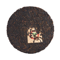 Dharma Cloud sheng puerh cake, front
