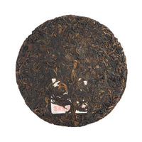 Fortuneteller sheng puerh cake, front