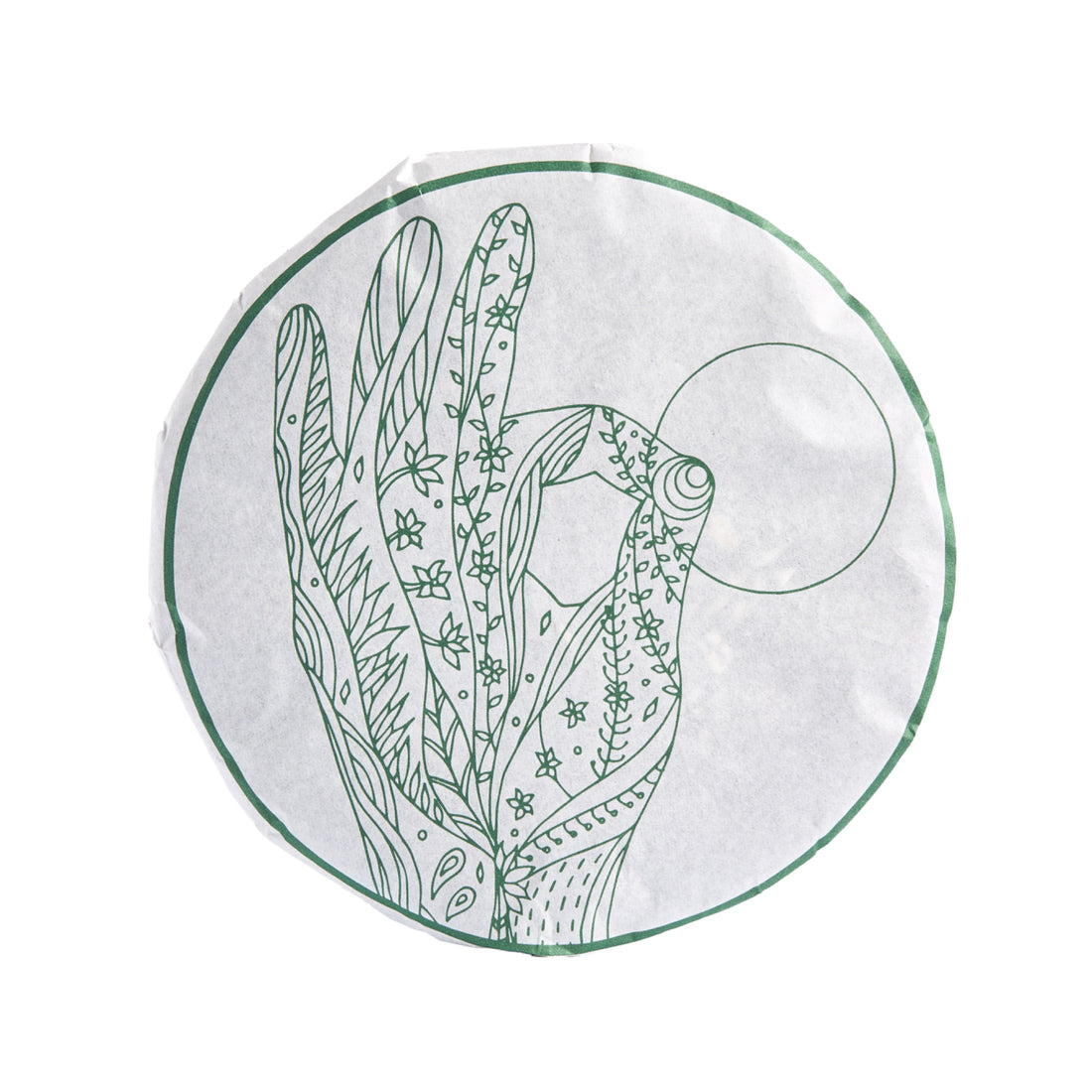 Grace sheng puerh cake in its paper wrapper