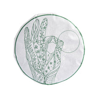 Grace sheng puerh cake in its paper wrapper