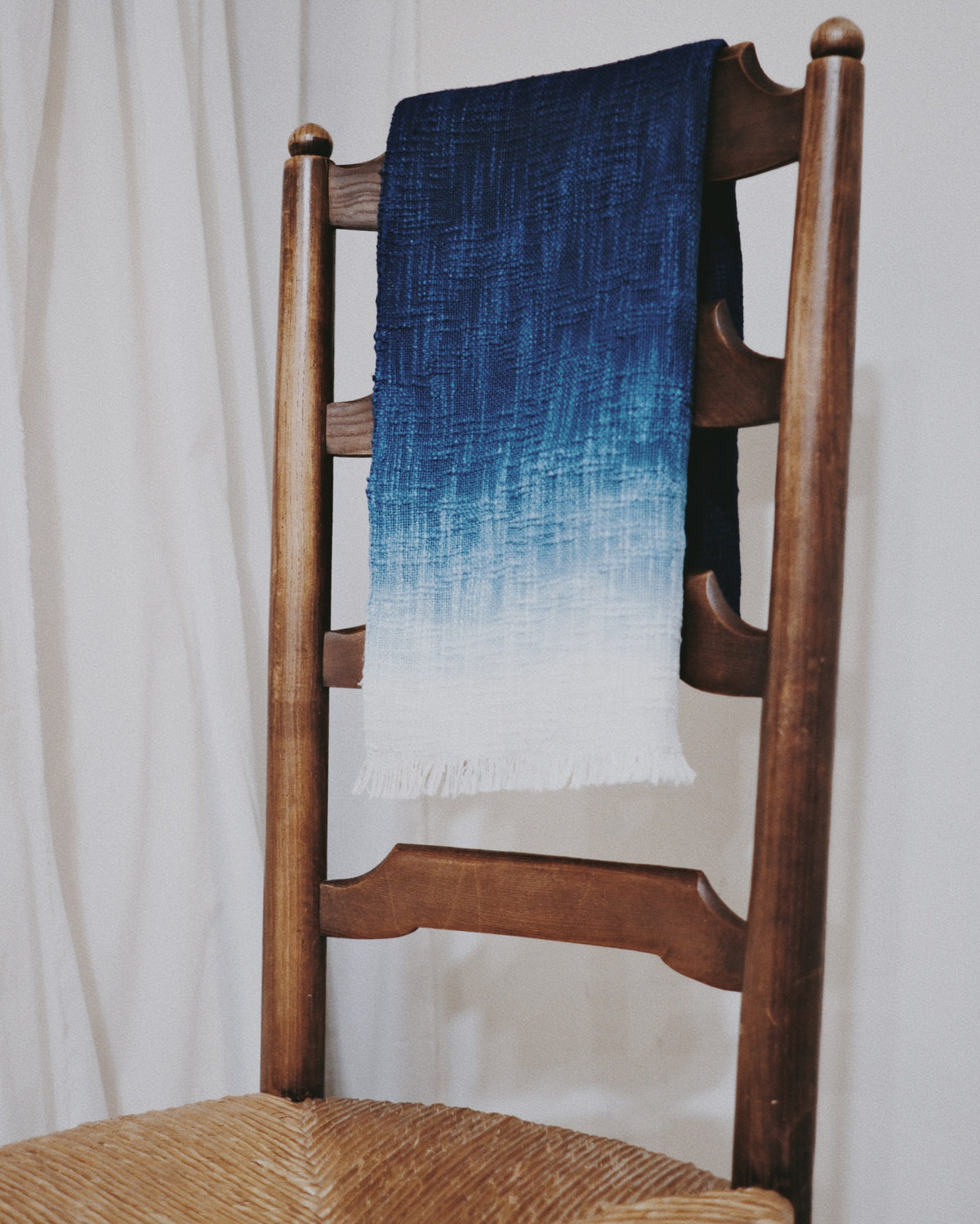 A finished indigo chabu draped over a chair