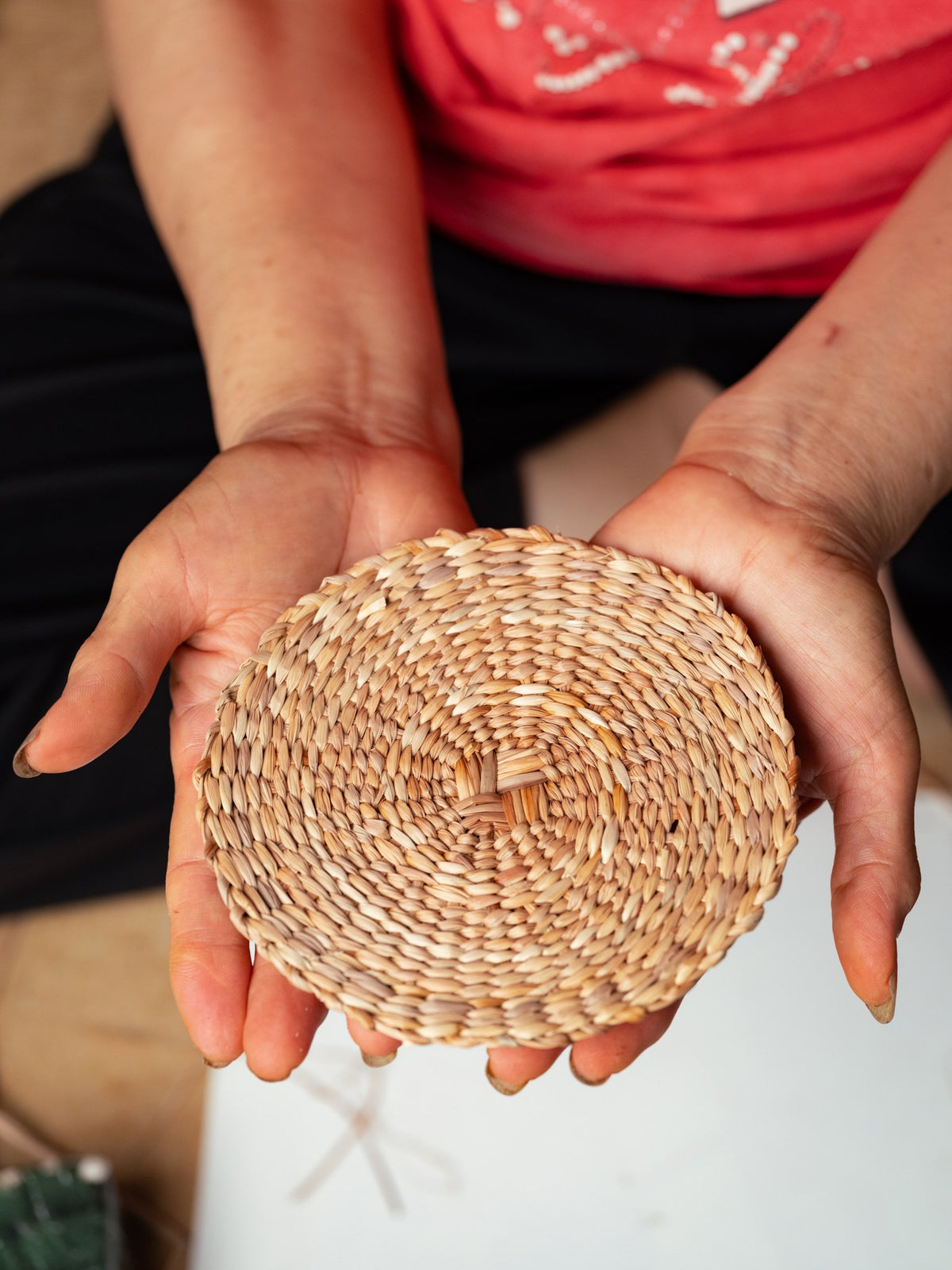 A finished handwoven rush trivet
