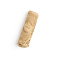 Vintage Mended Rice Sack Chabu rolled, showing the small square patch