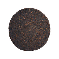 The Wanderer sheng puerh cake, front
